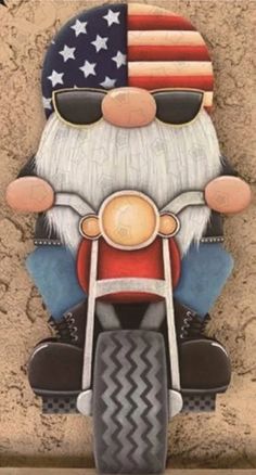 a painting of santa claus on a motorcycle with an american flag in the back ground