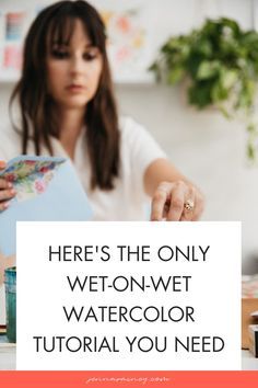 a woman sitting at a table with a notepad in her hand and the words here's the only wet - n - wet watercolorer you need