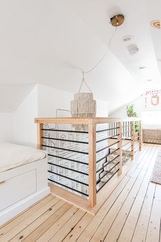 a room with wooden floors and white walls