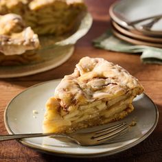 a piece of pie on a plate with a fork