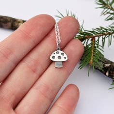 Delicate mushroom pendant handmade in sterling silver. Oxidized and polished to  a mirror shine or brushed to a matte finish. Great accessory for the mycology enthusiast! Matching earrings here: https://www.etsy.com/ca/listing/1551836846/mushroom-studs-fungi-studs-sterling?click_key=5205249ec82236a9e214469113a7cc47fc66a121%3A1551836846&click_sum=559f7452&ref=shop_home_active_2 More jewelries from Lucie Veilleux, here: https://www.etsy.com/ca/shop/LucieVeilleux?ref=seller-platform-mcnav Silver Pendant Necklace With Mushroom Design, Unique Sterling Silver Mushroom Design Jewelry, Jewelry Mushroom, Mushroom Necklace, Mushroom Pendant, Mushroom Jewelry, Mushroom Art, Lovely Ring, Jewelry Inspo