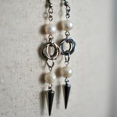 These handmade earrings blend edgy and elegant styles, featuring a unique mix of freshwater pearls and stainless steel spikes. The interlocked stainless steel chainmail rings provide structure, while the white pearls add a touch of softness. Finished with a bold spike detail, these earrings are perfect for those who love to mix classic and punk-inspired designs. Lightweight and hypoallergenic, they're great for daily wear or as a statement accessory. Chainmail Ring, Chain Mail Earrings, Chainmail Earrings, Palm City, Punk Inspiration, Elegant Styles, Chain Mail, Earring Backs, Elegant Fashion