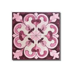 a pink and white tile with hearts on it's center piece, in the middle of