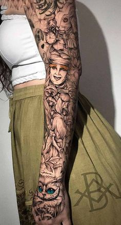 a woman's arm with tattoos on it