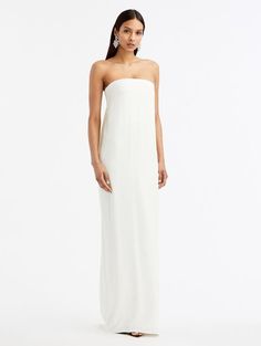 This classic gown is as practical at it is beautiful. With a relaxed silhouette, column silhouette and delicate draped detailing at the back, this piece is anything but ordinary. Classic Gown, Bride Things, Wedding Guest Accessories, Barbie Sewing, Column Gown, Column Dress, Wedding Looks, Decoration Design, Bridal Collection