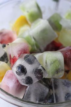 a bowl filled with lots of different types of gummy bears on top of each other