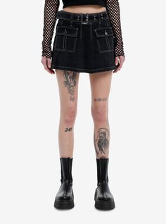 Every baddie needs a black denim skirt! This pleated one features front pockets with button closures and a removable grommet belt. Comes with white contrast stitching throughout.97% cotton; 3% spandexWash cold; dry flatStretchy materialLength: 14''ImportedListed in junior sizesModel is 5'10''Model wears size Small Baddie Needs, Skirts Hot, Grommet Belt, Pleated Denim Skirt, Pleated Denim, Punk Clothing, Black Denim Skirt, Stylish Skirts, Mini Cute