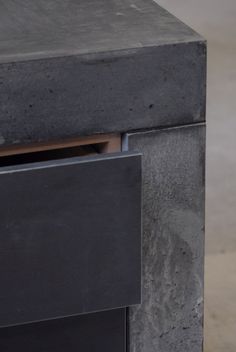 a close up of a black table with drawers