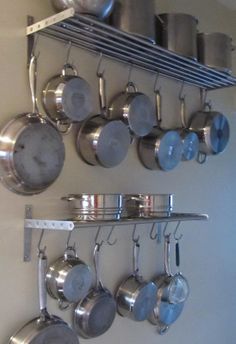 pots and pans are hanging on the wall