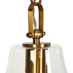 a brass and clear glass light fixture on a white background