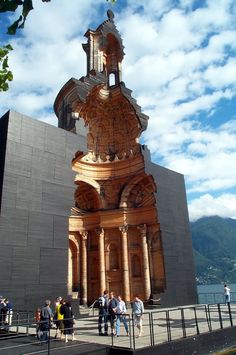 people are standing in front of a tall building