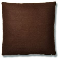 a brown pillow on a white background