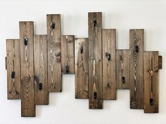 several pieces of wood hanging on the wall