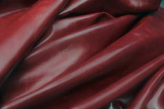 a close up view of a red leather material