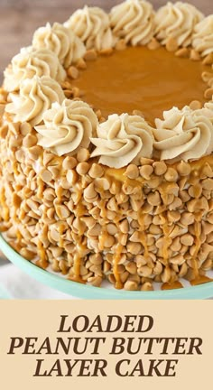 a peanut butter layer cake on a plate with the words loaded peanut butter layer cake