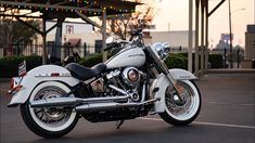 a white motorcycle parked in a parking lot