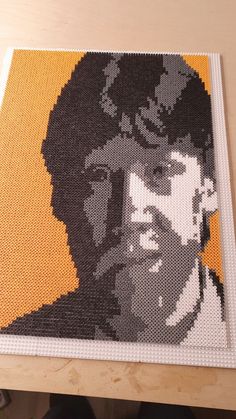 a close up of a piece of art made out of legos