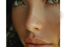 a close up of a woman's nose and nose piercing