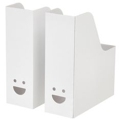 two white boxes with faces drawn on them