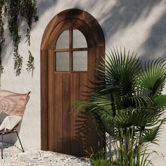 a chair sitting on top of a table next to a door and potted plant