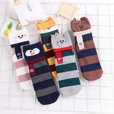 Step into warmth and comfort with our SnuggleToes collection! Featuring endearing animal faces — from a playful penguin to a mischievous cat — these socks are not just cozy but also irresistibly cute. The colorful striped patterns paired with little scarves on each animal add a festive winter charm. Perfect for lounging at home or adding a fun twist to your daily outfit. Cozy up your feet with the delightful designs of SnuggleToes and let every step be a statement of fun and comfort! Socks Cotton, Warm Socks, Funny Socks, Cute Socks, Striped Socks, How To Wear Scarves, Christmas Socks, Sock Gifts, Kids Socks