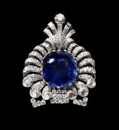 Elegant Sapphire Diamond Brooches, Elegant Sapphire Diamond Brooch, Luxury Jeweled Brooches, Elegant Oval Blue Brooches, Elegant Blue Oval Brooches, Luxury Silver Brooch With Jewels, Luxury Sapphire Brooch Jewelry, Luxury Silver Brooches With Jewels, Luxury Hallmarked Oval Brooch