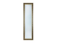 a gold framed mirror sitting on top of a white wall