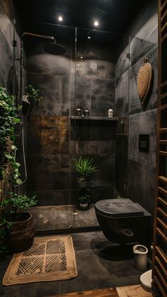 a bathroom with a shower, toilet and plants