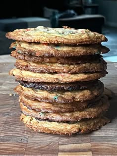 a stack of cookies sitting on top of a wooden cutting board