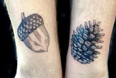 two people with matching tattoos on their arms holding pinecone and acorns