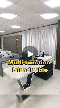 a kitchen with an island table in the middle and white tile flooring on the other side