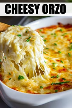 a wooden spoon scooping cheese from a casserole dish