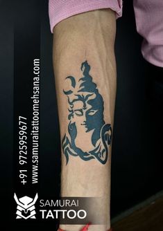 a woman's arm with a tattoo on it that has an image of a buddha