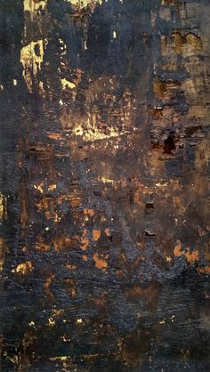 an abstract painting with gold and black colors