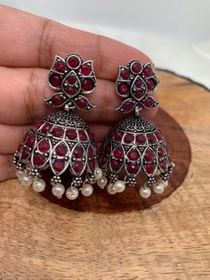 Red Stone Pearl Jhumka Red Temple Jewelry Jhumkas For Celebration, Red Temple Jewelry Jhumkas For Festivals, Festive Red Jhumkas With Stone Work, Heavy Red Ruby Earrings, Red Chandbali Jewelry With Latkans, Red Stone Work Temple Jewelry Jhumkas, Festive Red Ruby Jhumkas, Red Stone Work Jhumkas For Diwali, Red Chandbalis With Latkans For Diwali