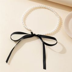 Trend Wedding Party Jewelry Long Black Ribbon Choker Necklace For Women Elegant White Imitation Pearl Beach Vacation Necklaces Necklace Type: Chains Necklaces Material: PEARL Pearl Type: Simulated-pearl Gender: Women Model Number: r6r Style: TRENDY Shape\pattern: Round Fine or Fashion: fashion Occasion: Anniversary Item Type: NECKLACES Compatibility: All Compatible Choice: yes semi_Choice: yes Black Ribbon Choker Necklace, Black Ribbon Choker, Ribbon Choker Necklace, Ribbon Choker, Pearl Beach, Trending Necklaces, Bow Necklace, Wedding Party Jewelry, Black Bracelets