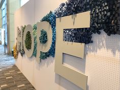 the word pop spelled out on a wall in an office