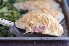 a close up of food on a pan with broccoli and meat in it