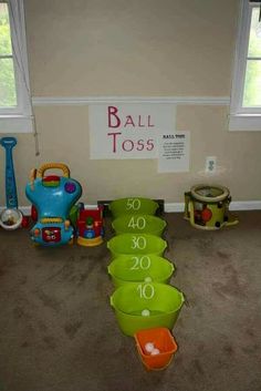 there are many bowls and toys in the room