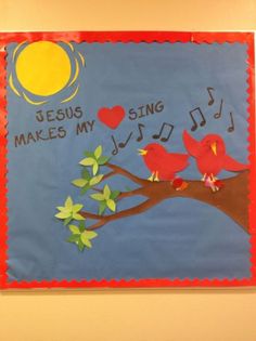 a bulletin board with two birds sitting on a tree branch and the words jesus makes my sing