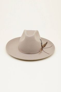 Introducing the CORBETT This striking western cowboy hat features exquisite feather detailing and an adjustable Velcro strap for a perfect fit. It starts at a base size of 59 cm but can be adjusted down to 57 cm with the inner Velcro strap. With a classic 13 cm tall crown and a 9.75 cm brim, this unisex hat is versatile enough for any occasion. It’s a standout piece designed to make a bold statement. Tall Crown, Thml Clothing, Melie Bianco, Beige Hat, Western Cowboy Hats, Feather Trim, Jewelry Tree, Cowboy Hat, Velcro Straps