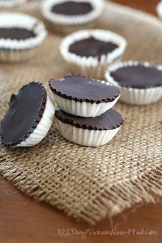 some chocolates are sitting on top of a burlap tablecloth and there is no one in the photo