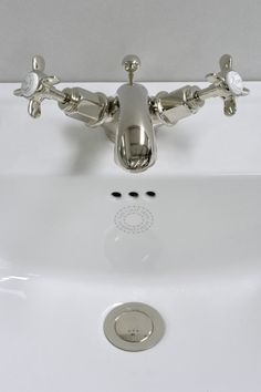 the faucet is attached to the sink in the bathroom