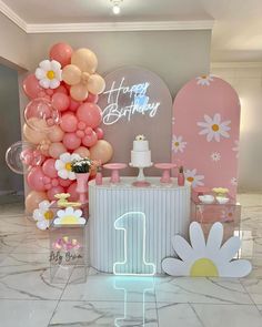 a birthday party with balloons, cake and decorations