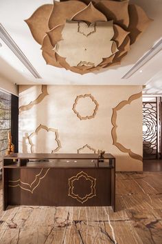 an elegant reception table in the middle of a room with large mirrors on the wall