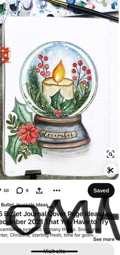 an image of a snow globe with a lit candle in it and holly wreaths