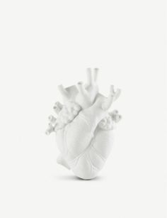 a white model of the human heart on a white background