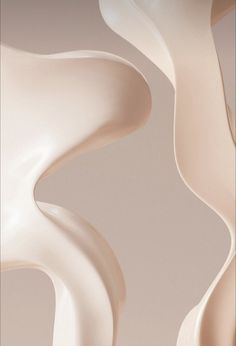 an abstract photo of flowing white liquid on a beige background, with the image in full color