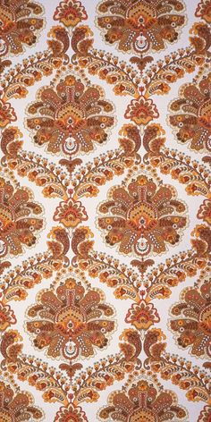 an orange and brown paisley print fabric