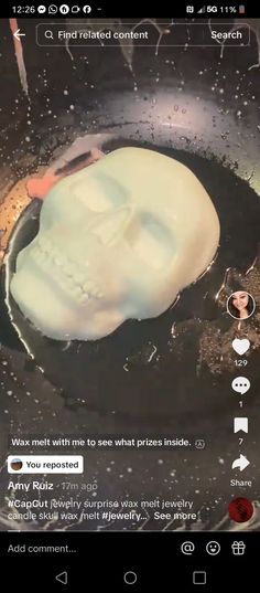 a skull frying in a skillet on top of a stove with other items